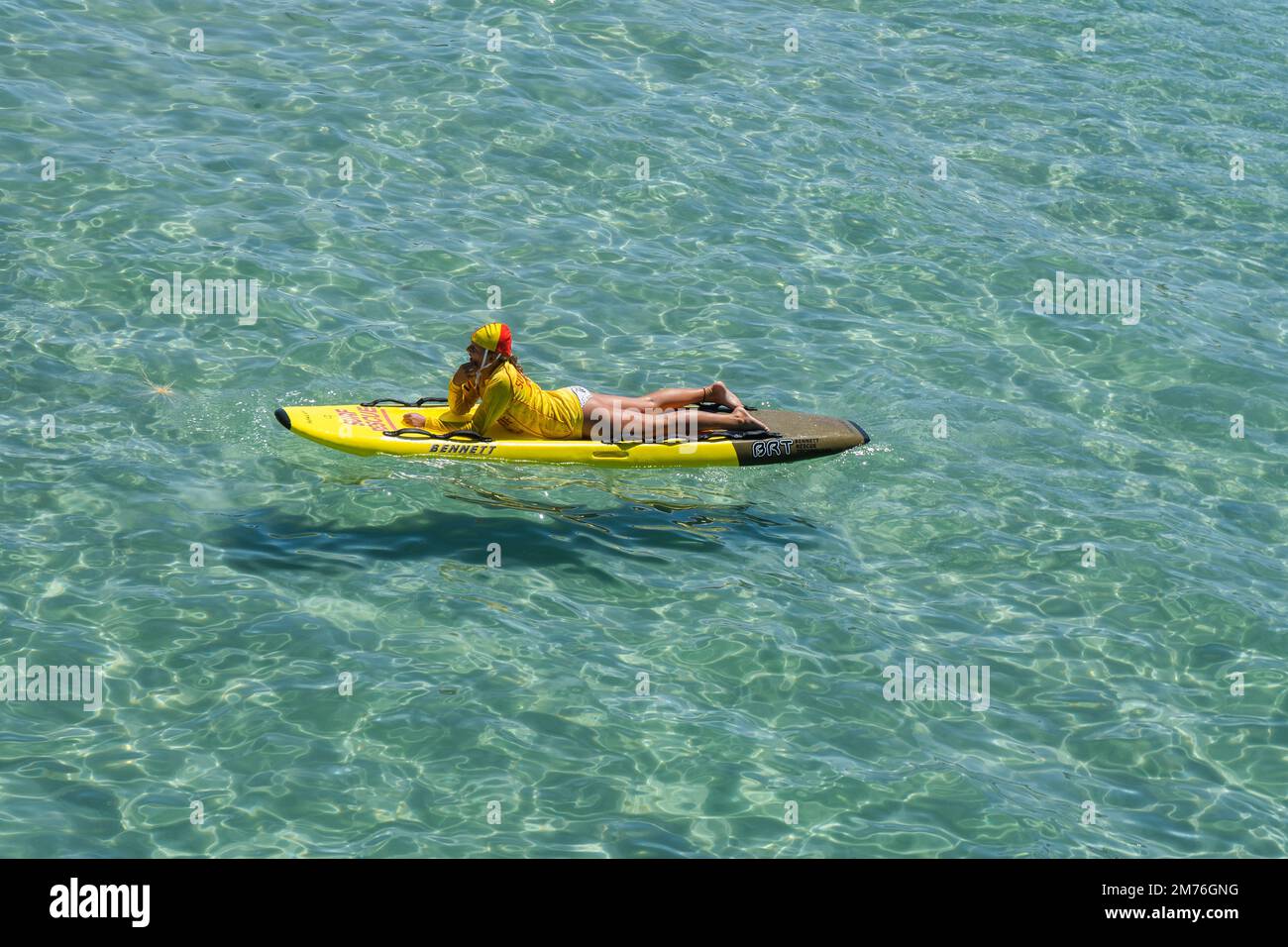 Adelaide, Australia. 8 January 2023 . Surf and rescue lifeguards practicing on surfboards on a