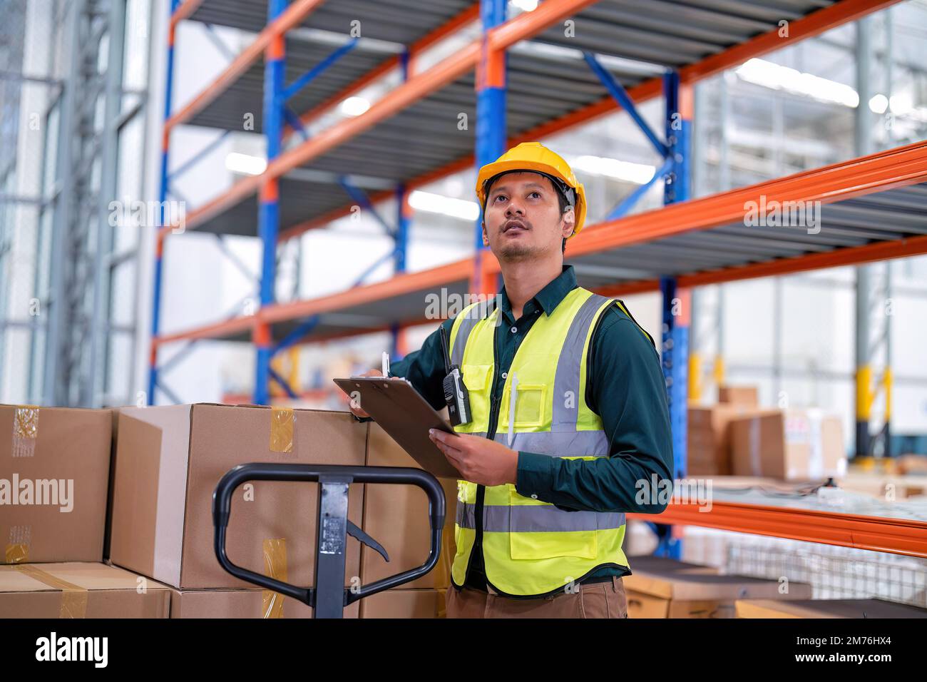 Perform Inventory Worker in warehouse hold tablet check list perform inventory stock ...