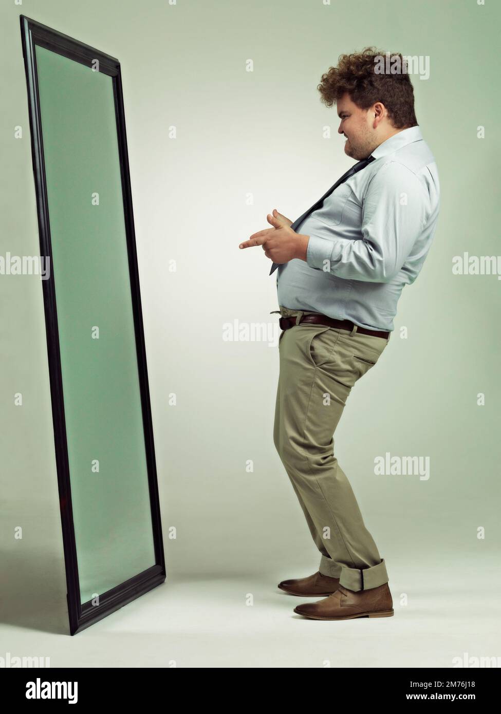 How you doing. an excited overweight man celebrating while looking in a