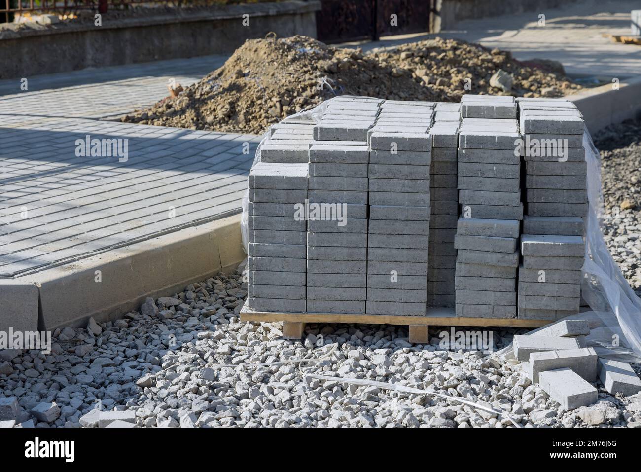 Preparation for laying gray concrete brick an pavement sidewalk