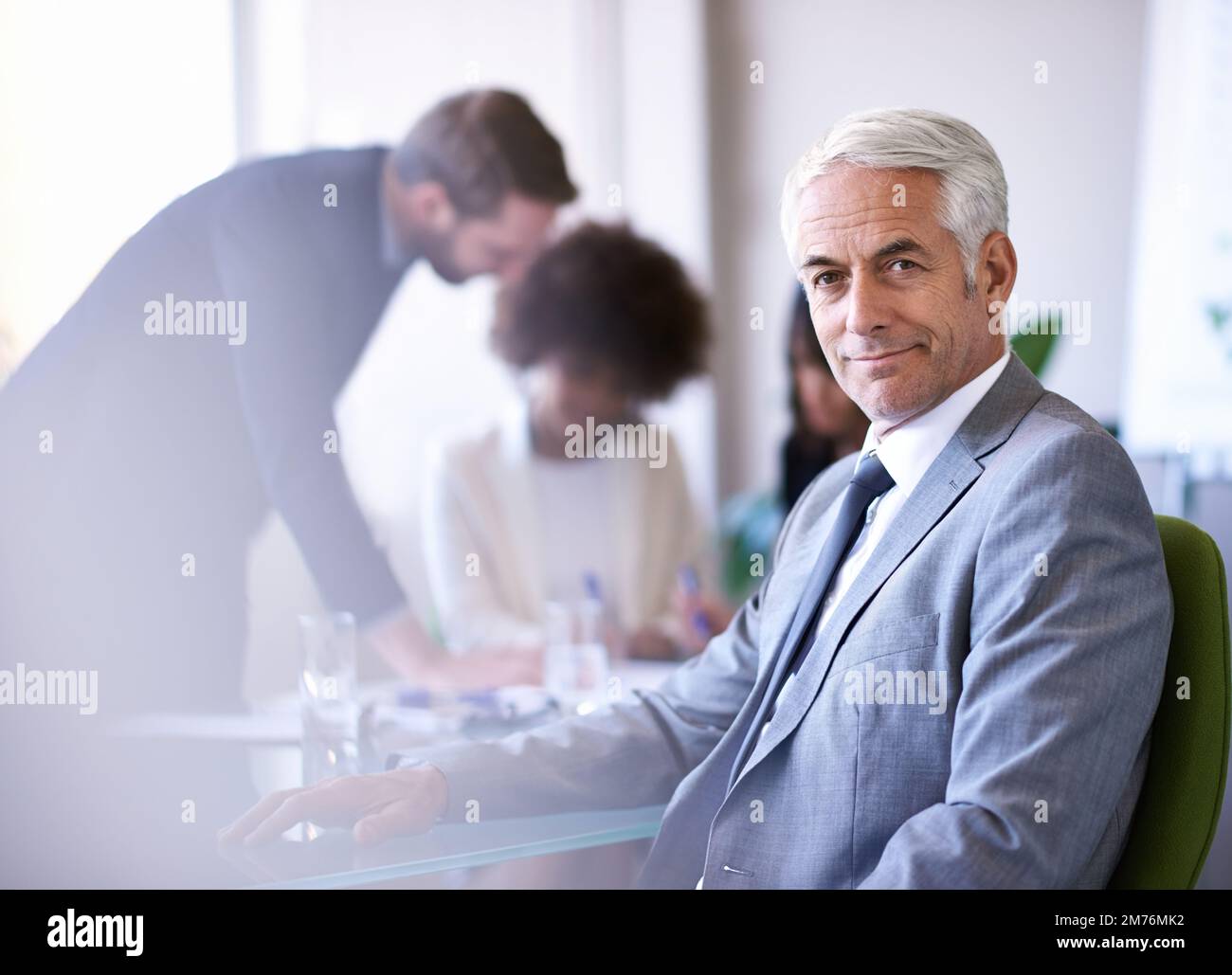 Getting the job done with teamwork. a group of business colleagues meeting in the boardroom. Stock Photo