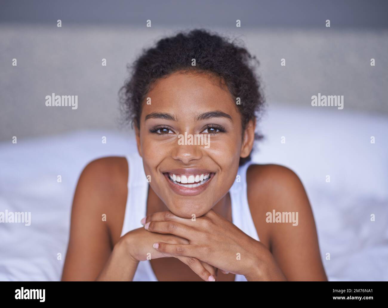 Enjoying a lazy weekend. Portrait of a beautiful young woman lying on a