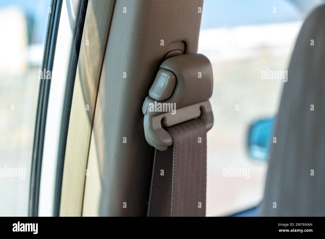 Seat belt height adjustment button in a vehicle Stock Photo Alamy