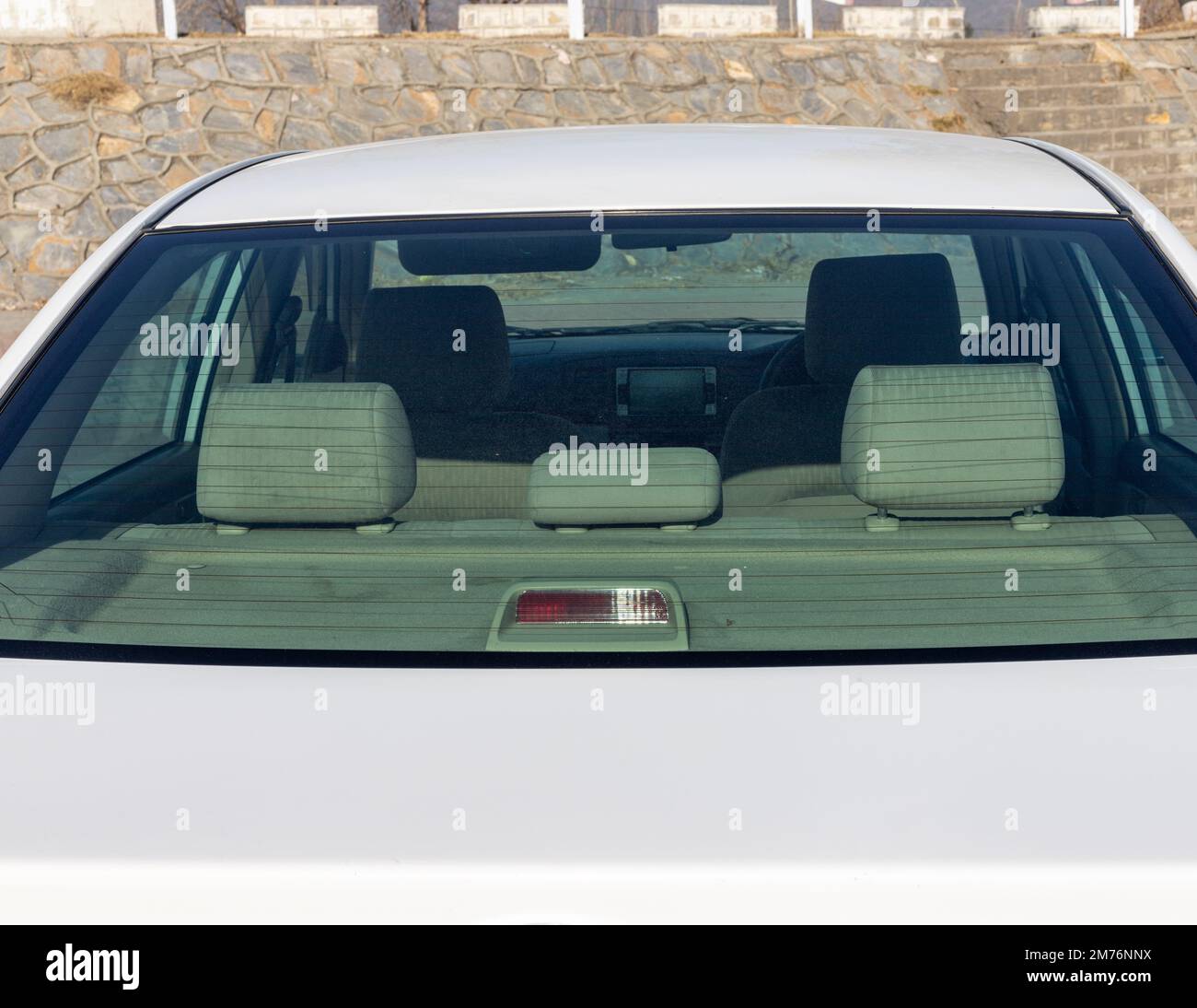 Rear seats headrest view inside the car back windshield Stock Photo