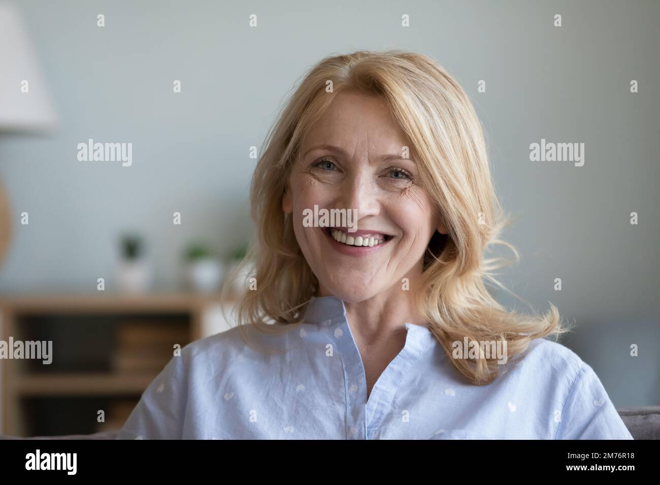 Happy positive senior pretty woman home head shot portrait Stock Photo