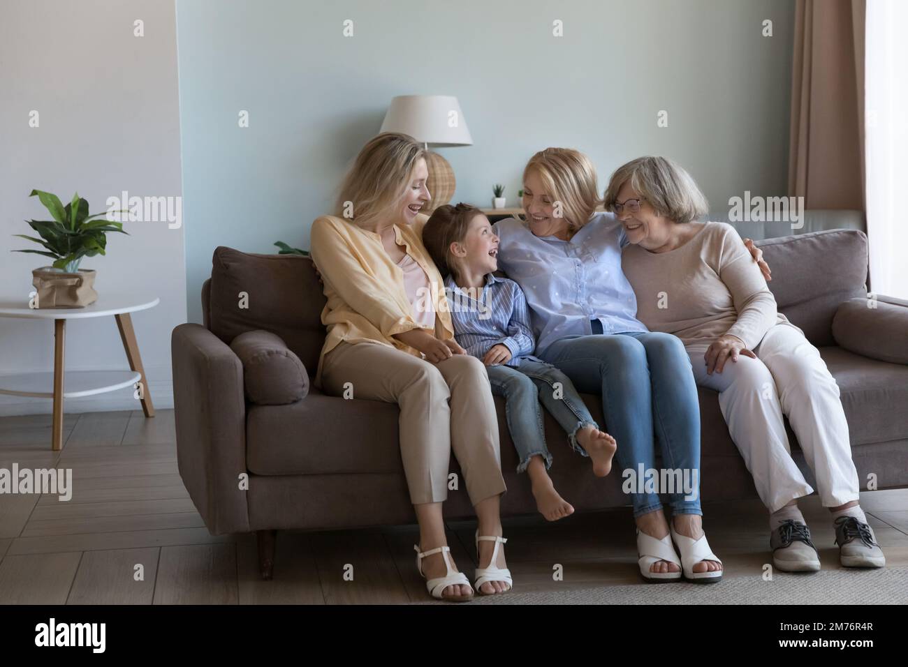 Family portrait of happy girls and women of four generations Stock Photo
