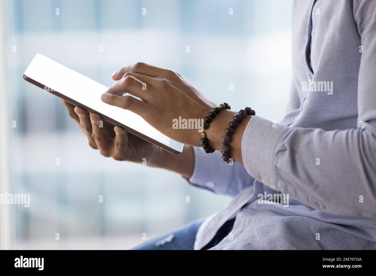 African business man holding digital tablet, close up Stock Photo