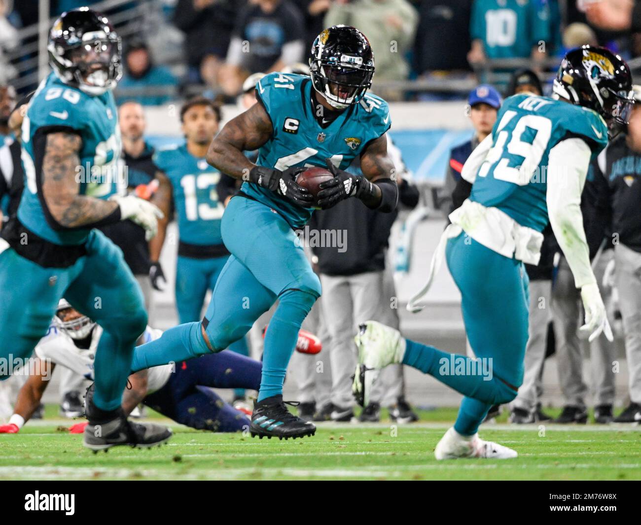 Dallas Cowboys vs. Arizona Cardinals . NFL Game. American Football League  match. Silhouette of professional player celebrate touch down. Screen in  bac Stock Photo - Alamy