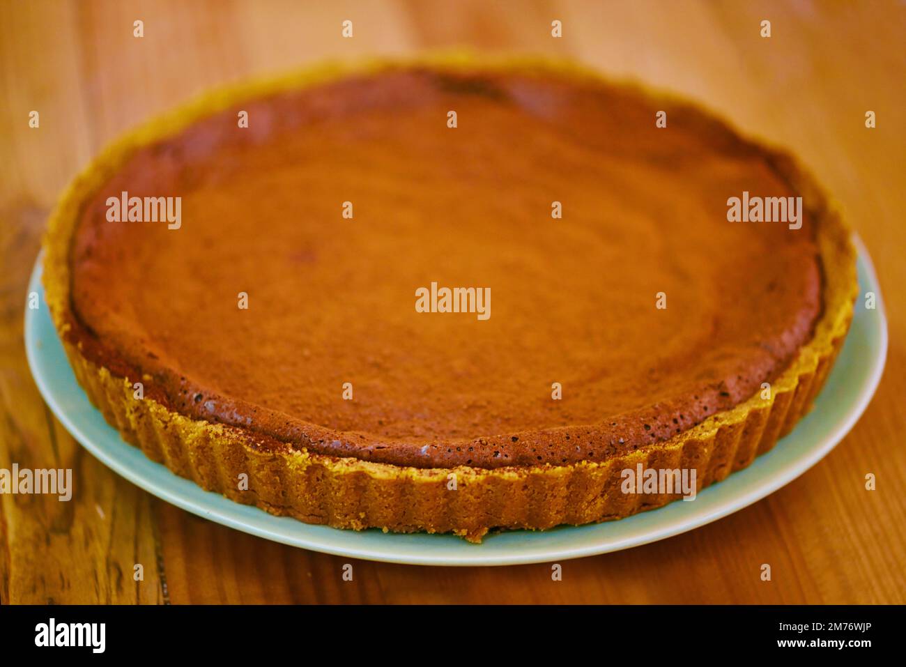 Pie thats pleasing to the eye. a delicious chocolate pie resting on a plate. Stock Photo