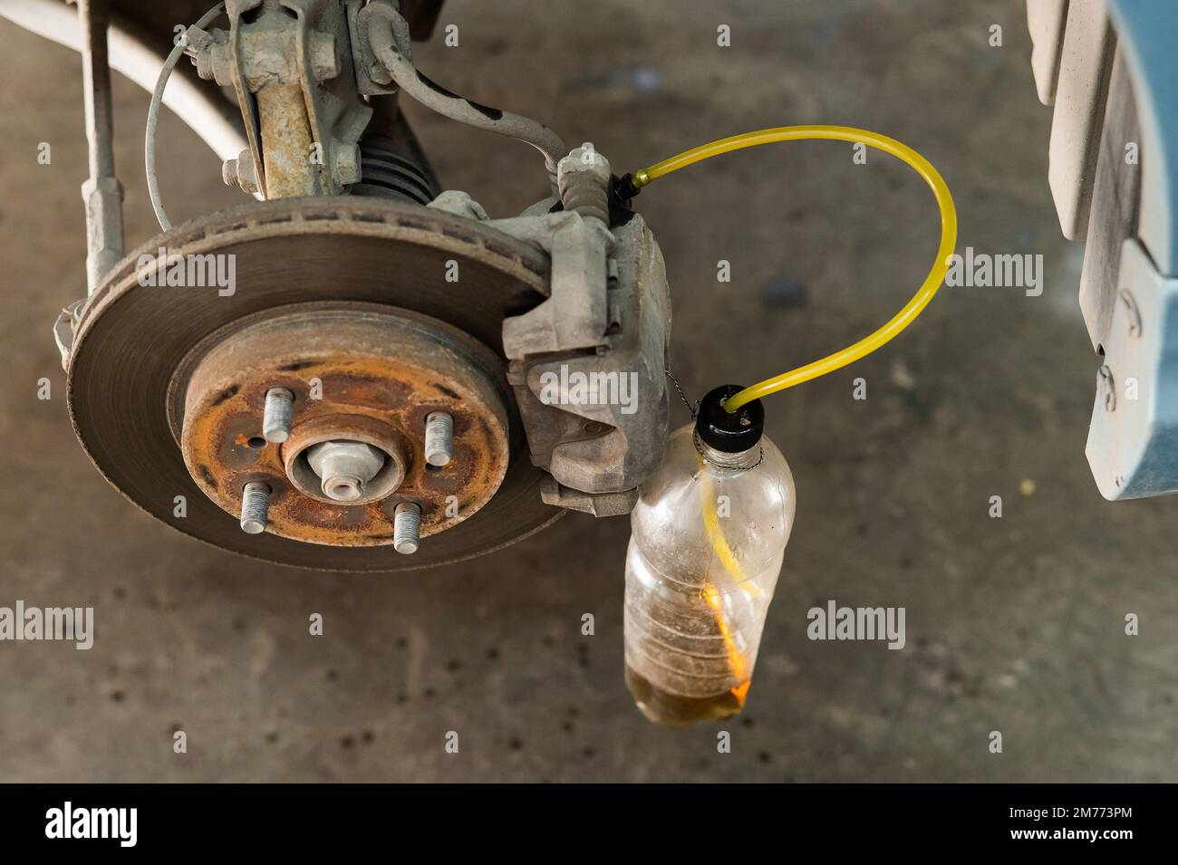 Automatic change of brake fluid in a car service Stock Photo Alamy