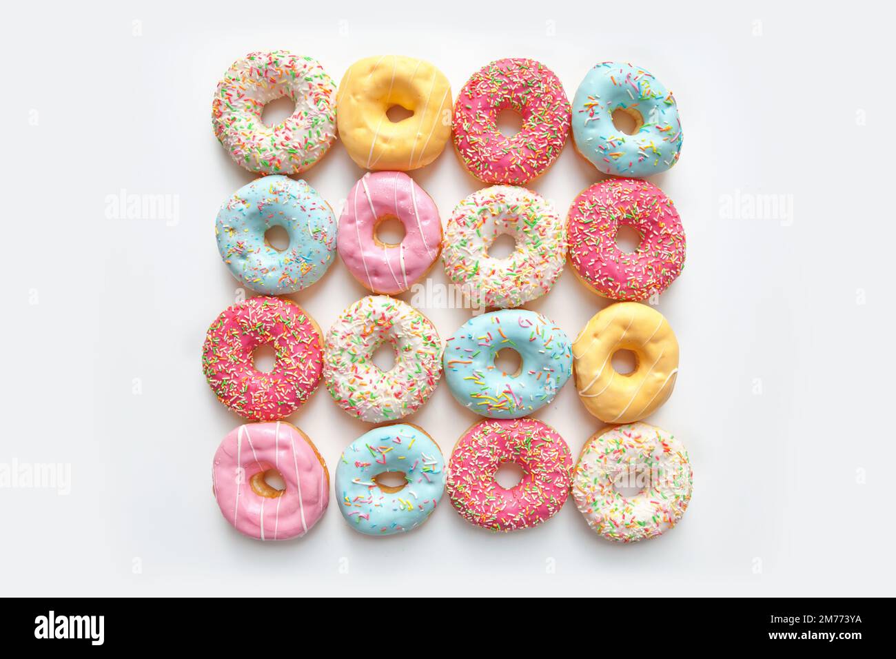 Colorful delicious donuts isolated on white background Stock Photo - Alamy