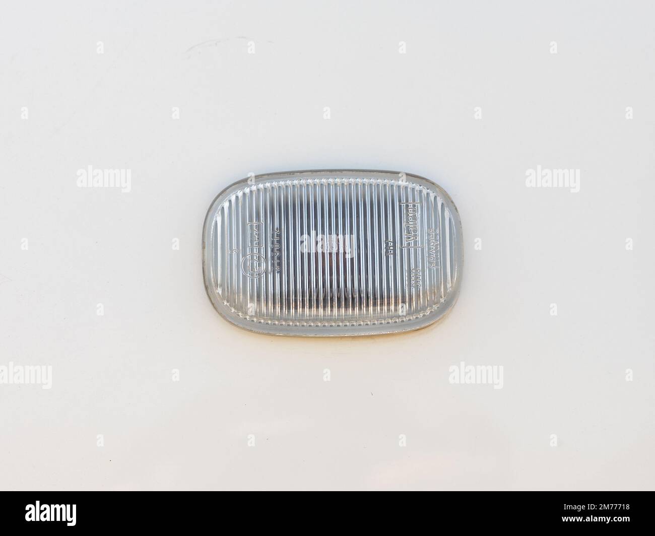 Swat, Pakistan - December 26, 2022 : Valeo side indicator of a vehicle small turn signal lamp is side of body Car head Stock Photo