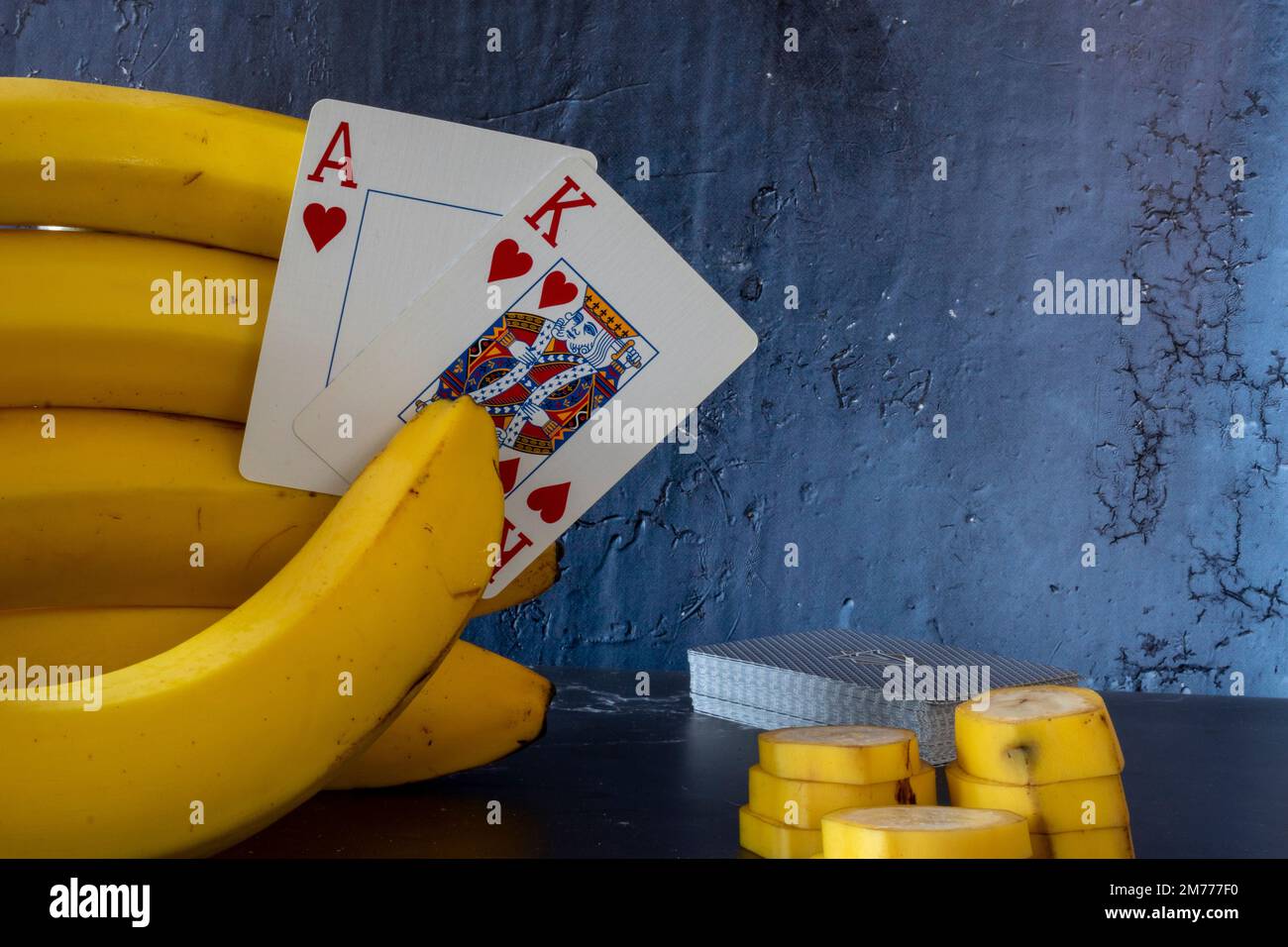 Banana hand and pokercard Stock Photo Alamy