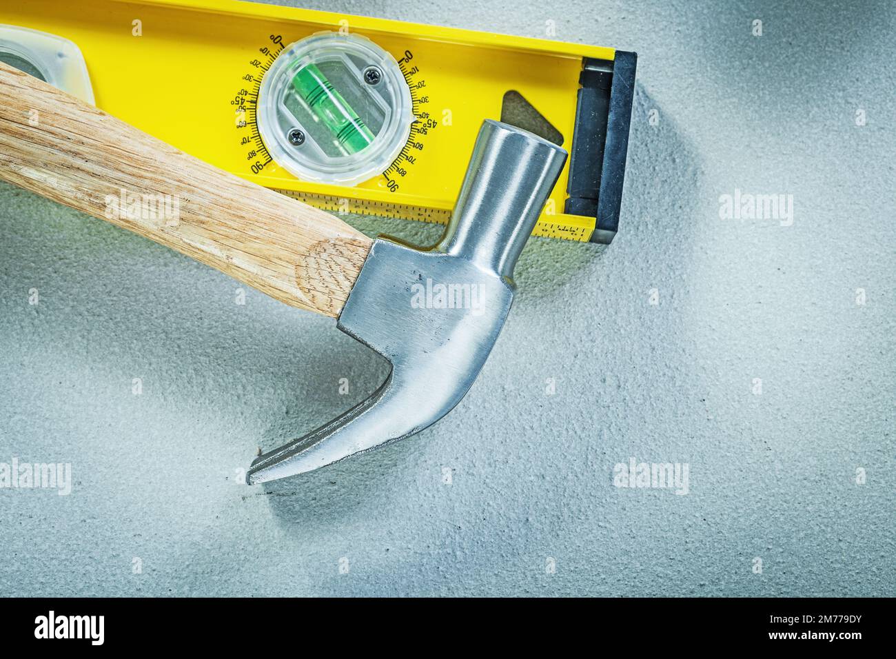 Claw hammer construction level on concrete background top view building ...
