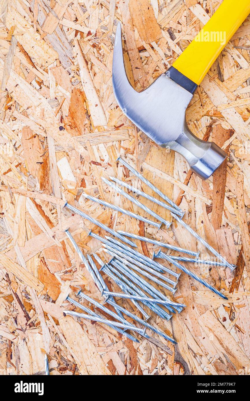 claw hammer with nails on plywood Stock Photo Alamy