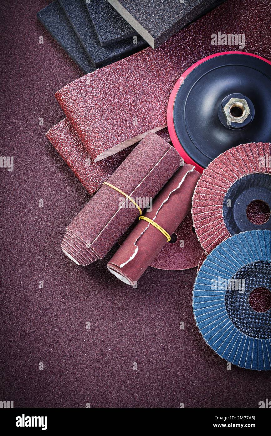 Collection of abrasive materials on polishing paper top view Stock