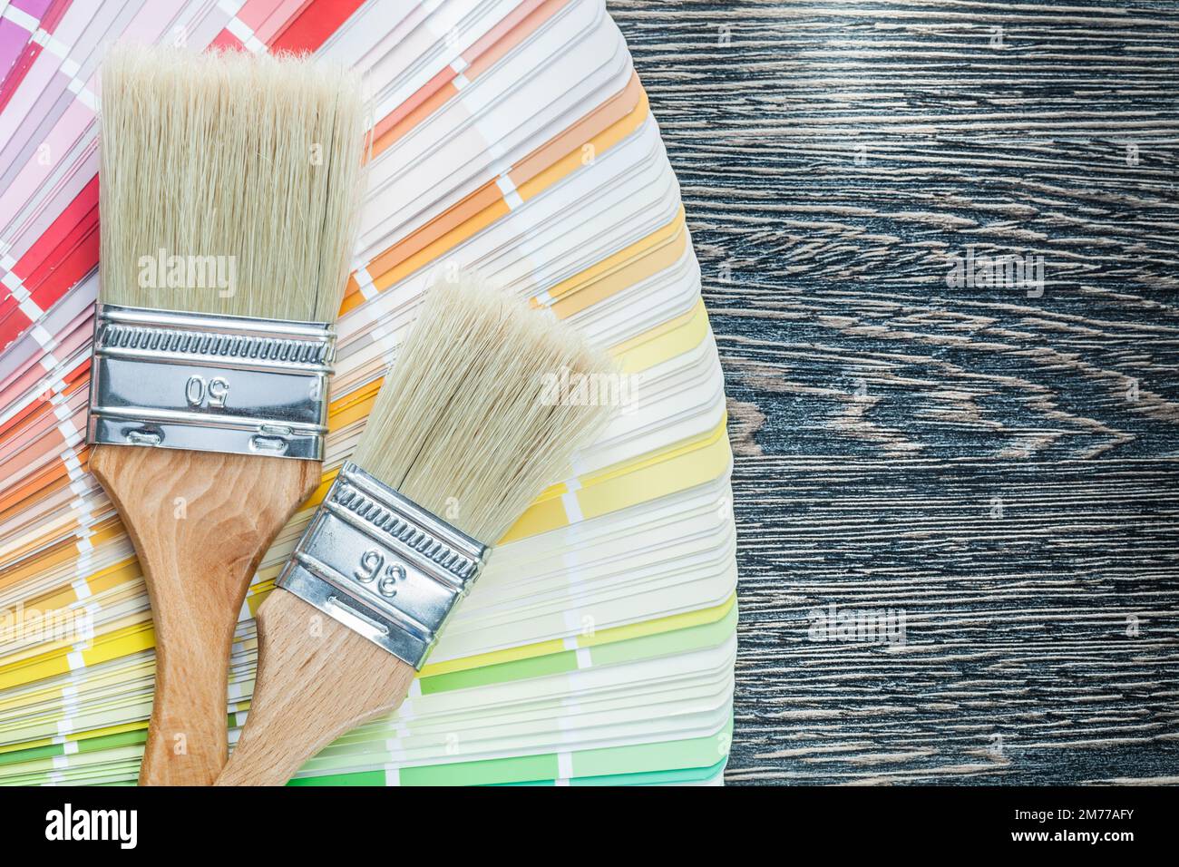 Color palette paint brushes on wooden board Stock Photo - Alamy