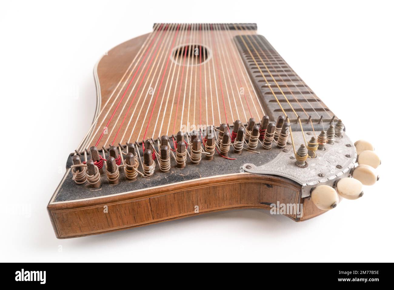 High angle closeup horizontal studio shot of vintage, old wooden zither