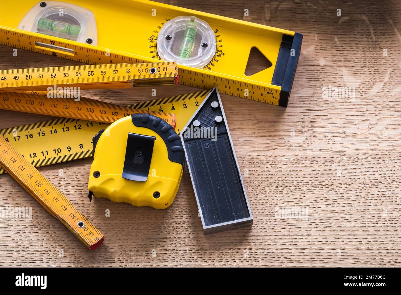 Oaken board with wooden meter measuring line construction level and ...