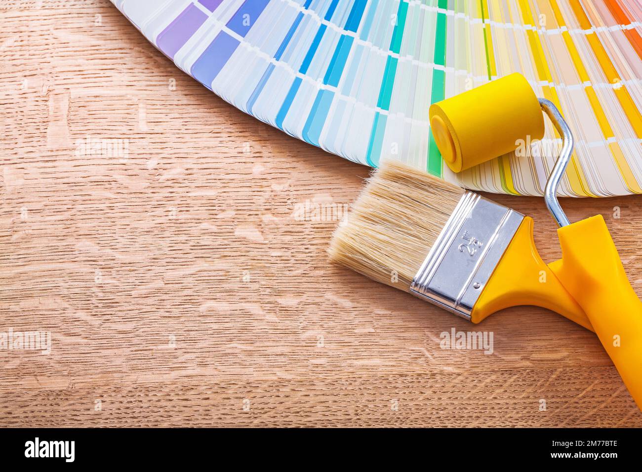 paint brush and roller color palette on wooden board Stock Photo Alamy