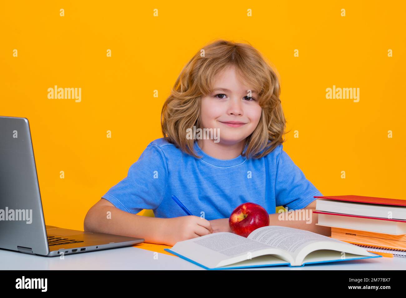 School child student learning in class, study english language at school. Elementary school child. Portrait of funny pupil learning Stock Photo