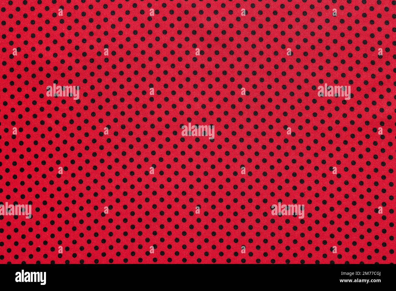 Pink polka-dot cotton table cloth. Stock Photo