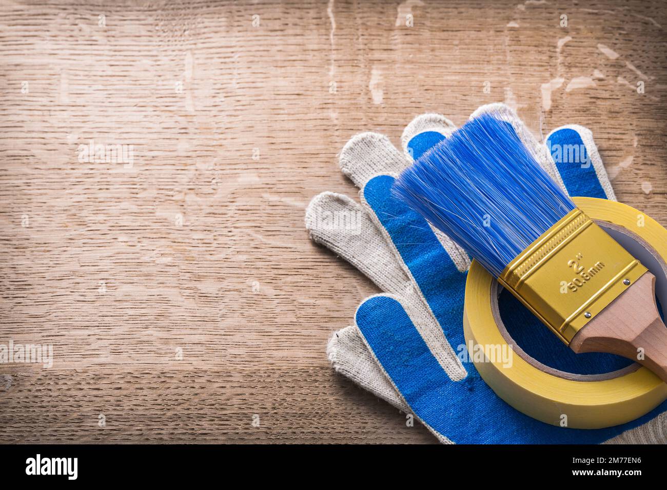Safety gloves paint brush adhesive tape construction concept Stock