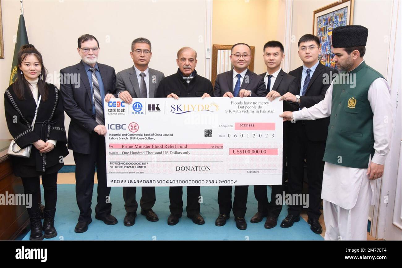 (230108) -- ISLAMABAD, Jan. 8, 2023 (Xinhua) -- Pakistani Prime Minister Shahbaz Sharif (4th L) attends a ceremony for donation of funds to the flood-affected people by the China Energy Engineering Corporation (CEEC) in Islamabad, capital of Pakistan, Jan. 6, 2023. Sharif has appreciated China and Chinese enterprises' great help to the flood-affected people of the country. (PID/Handout via Xinhua) Stock Photo