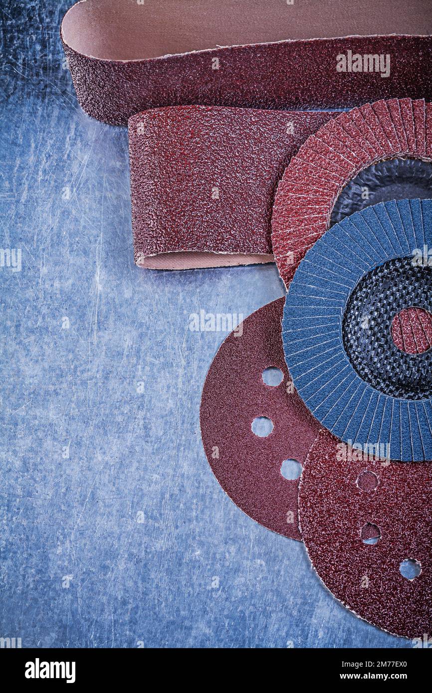 Sandpaper abrasive discs flap grinding wheels on metallic background