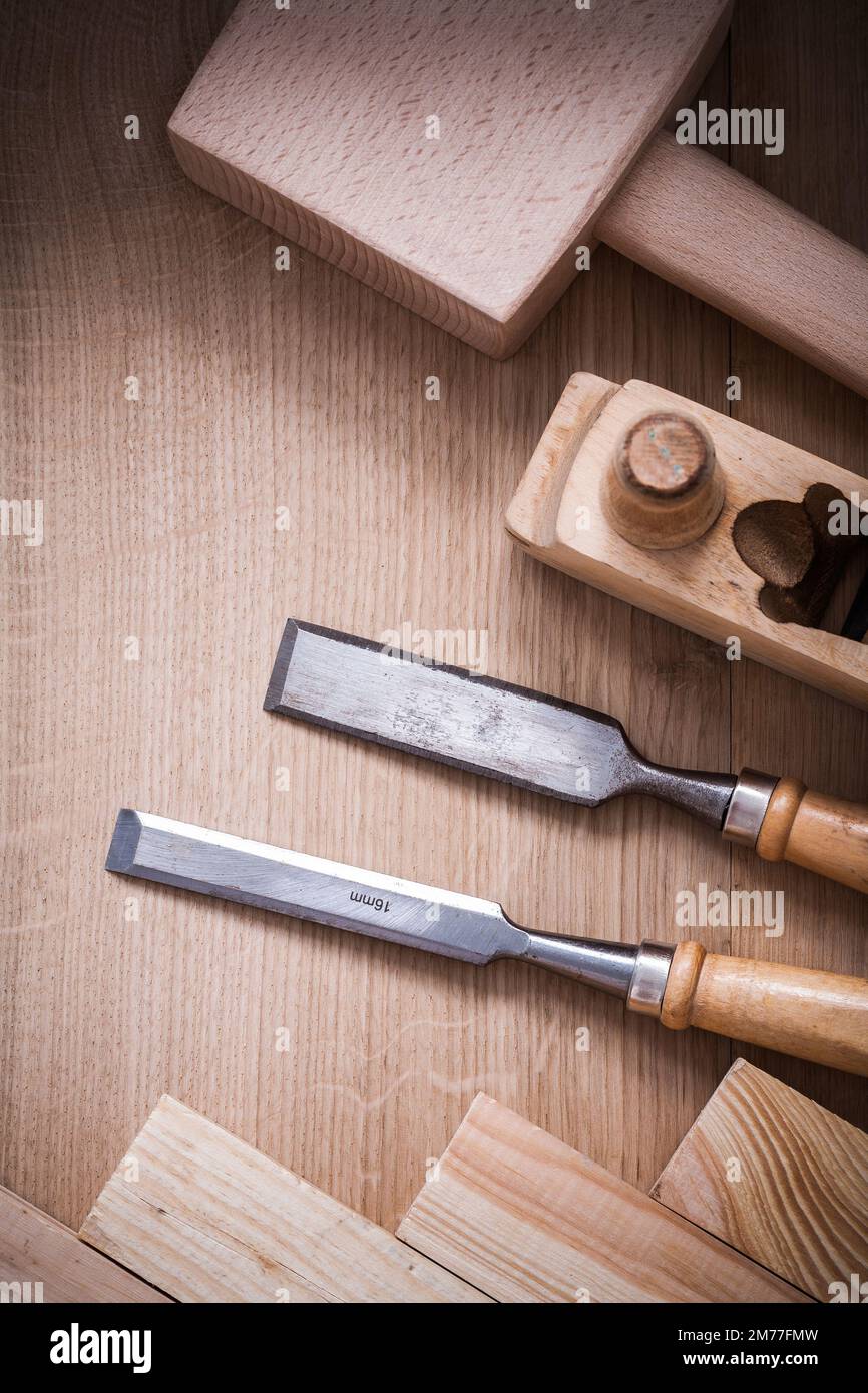 Set of wooden joiner’s working tools on wood textured board construction concept. Stock Photo