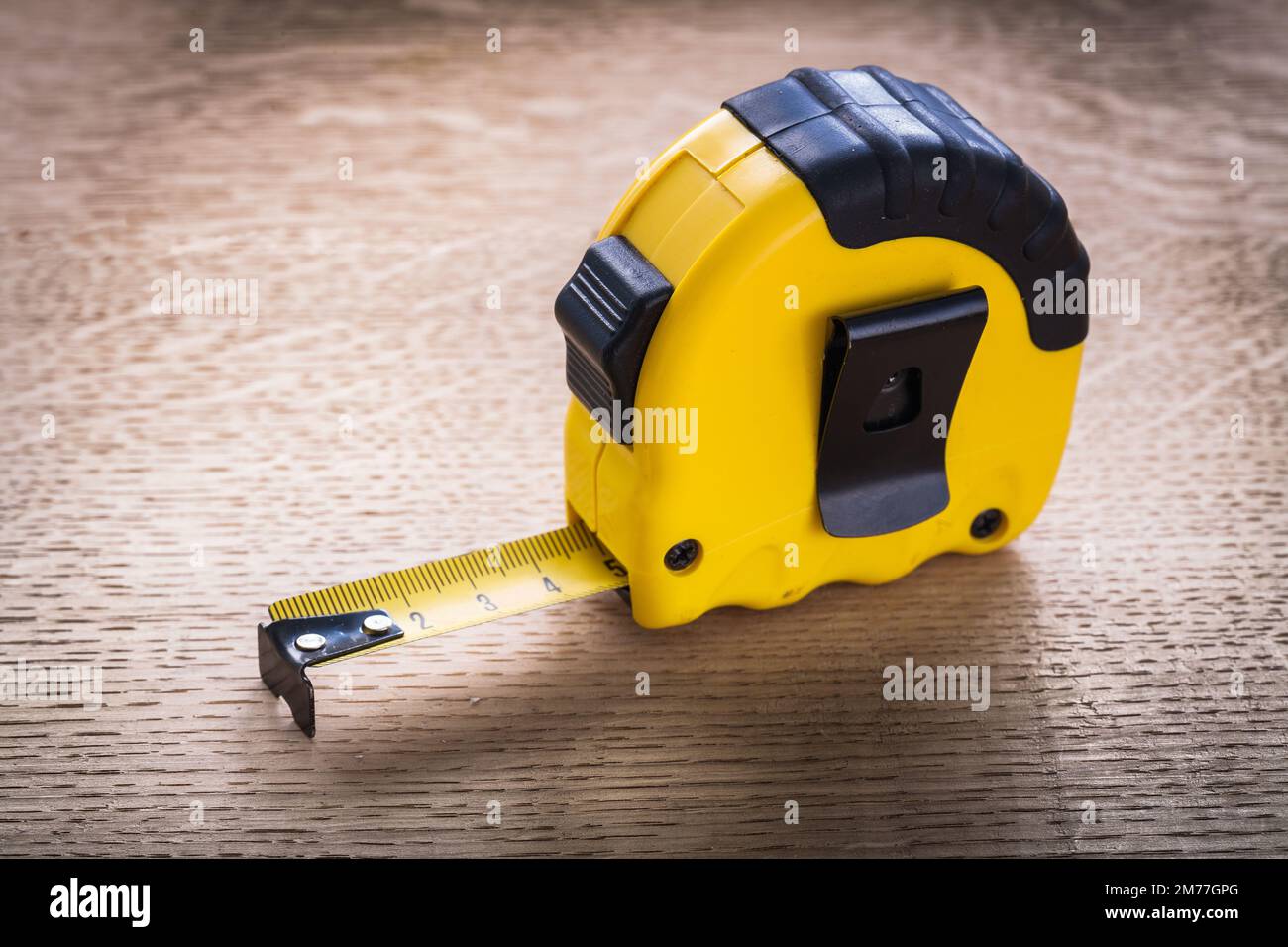 Tape measure on oaken wooden board maintenance concept Stock Photo Alamy