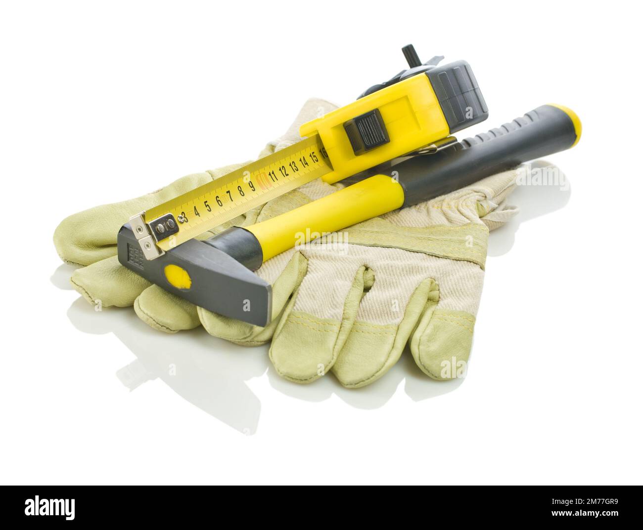 tapeline and hammer on gloves Stock Photo