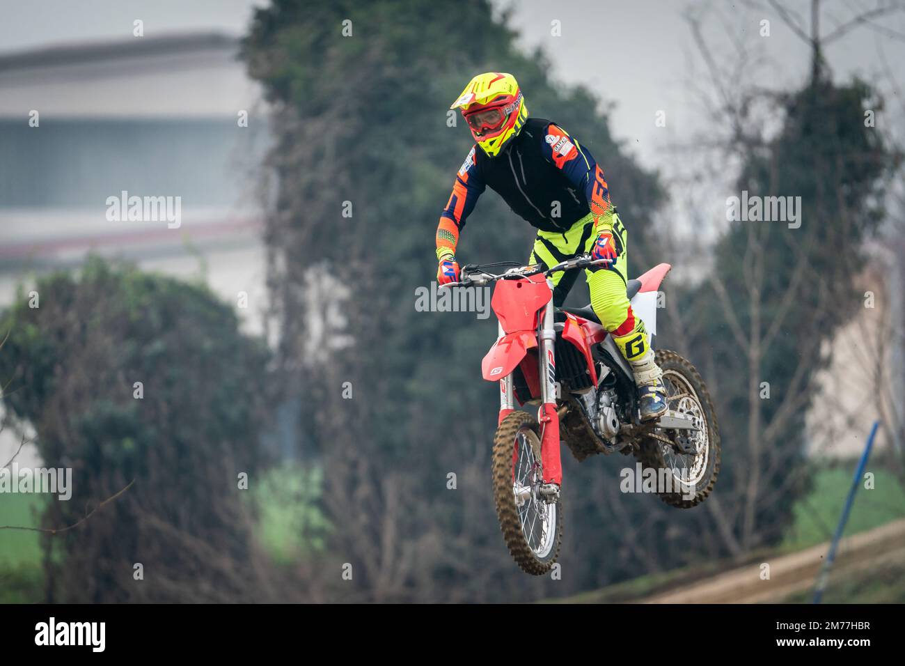 Crema, Italy – 12/2022: Motocross bike performing stunts on training track Stock Photo