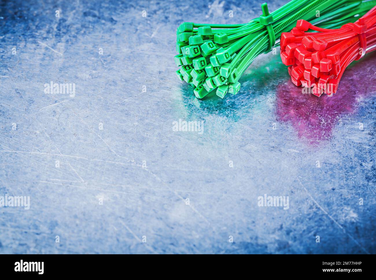 Variation of self-locking cable ties on metallic background construction concept. Stock Photo