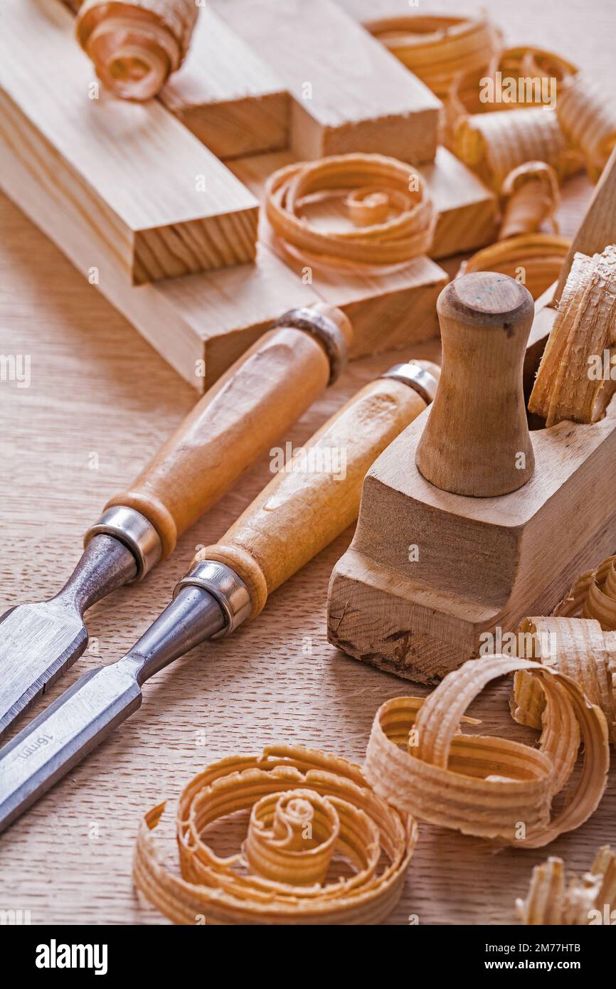 very close up view joinery tools old fashioned woodworkers plane chisels planks shawings Stock