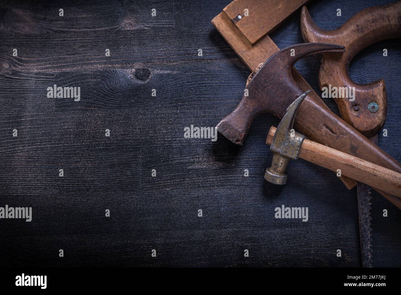 Vintage square ruler claw hammers hand saw construction concept Stock