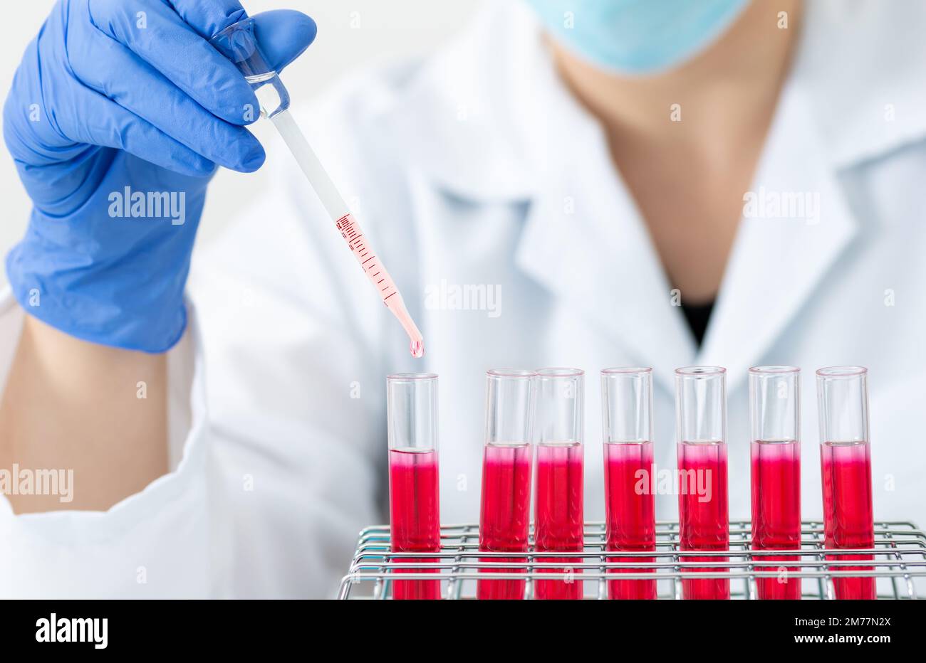 Cropped shot of a scientist conducting an experiment in a laboratory Stock Photo