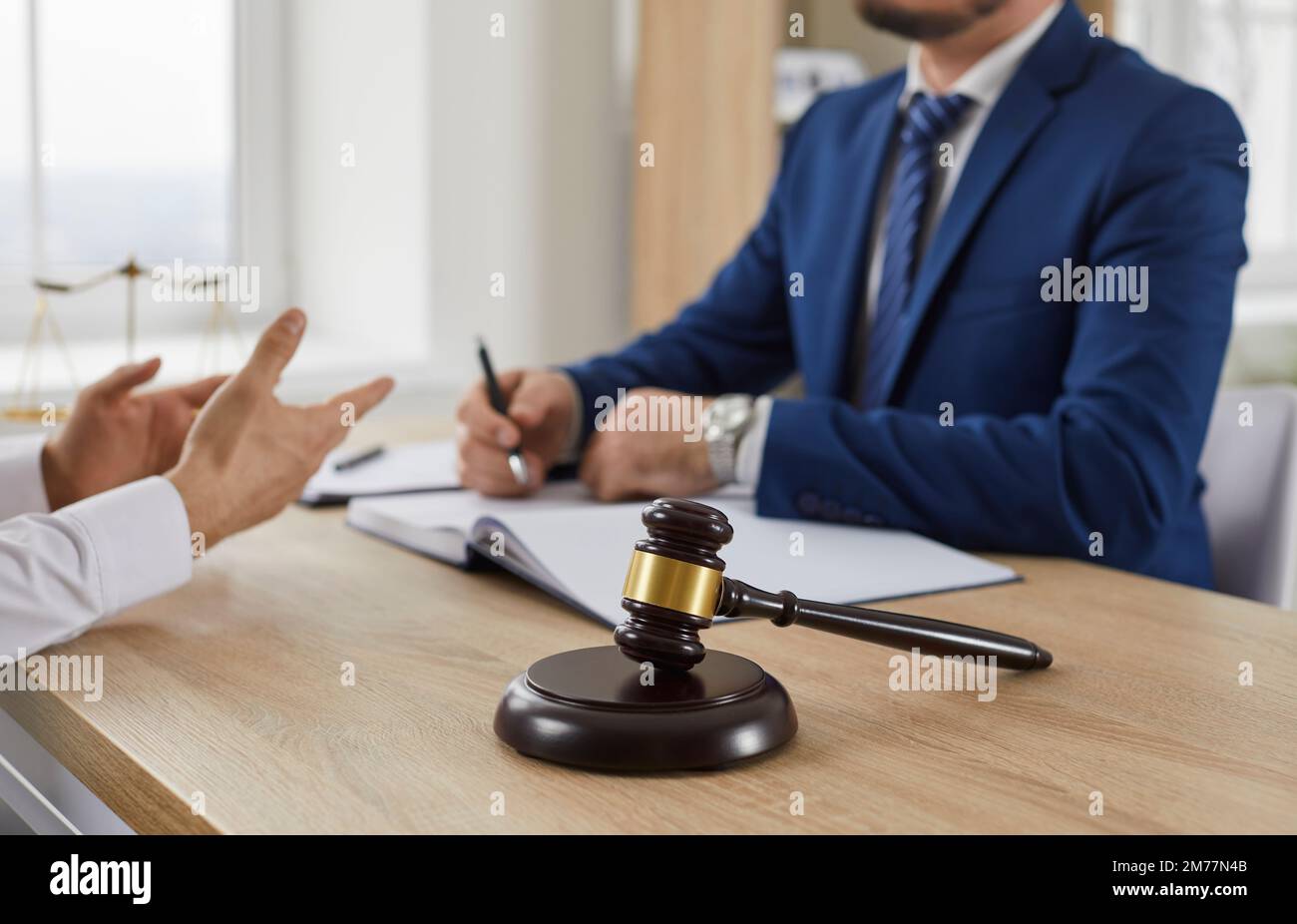 Close up of judicial wooden gavel on stand in the courtroom. Stock Photo