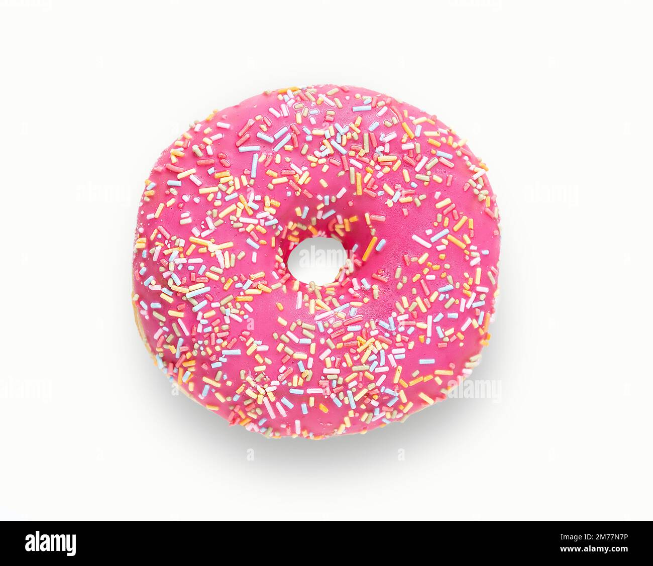 Purple donut in glaze on a white background Large fresh and tasty purple donut drizzled with icing with copy space Stock Photo