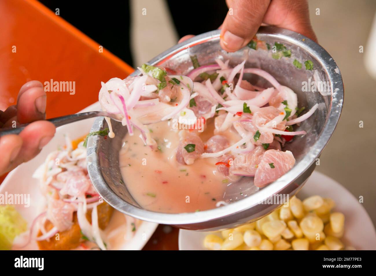 Preparing a delicious Peruvian sea bass ceviche in the fishing port of