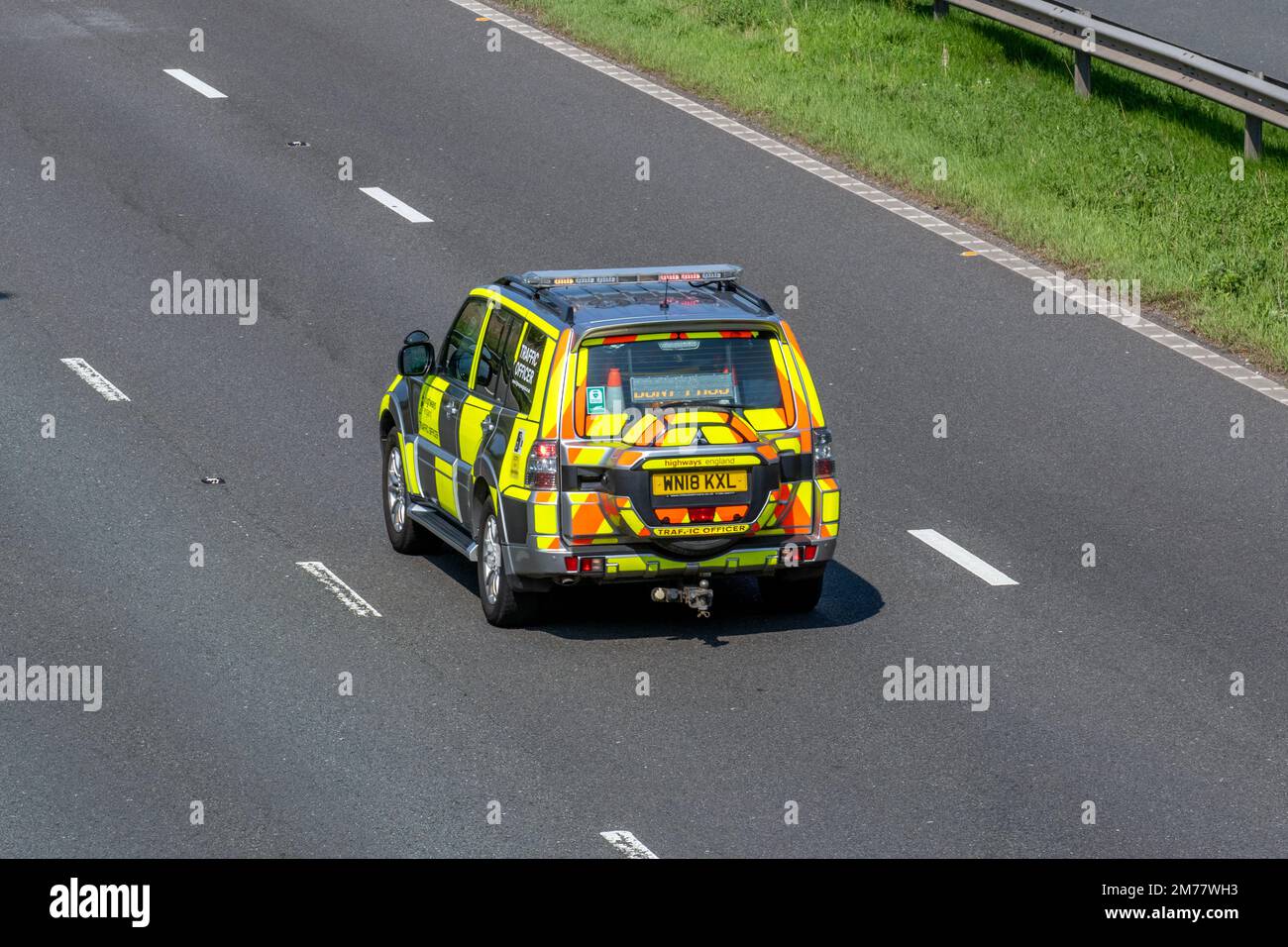 'Don't Pass' LED  sign on the rear of HIGHWAYS ENGLAND TRAFFIC OFFICER Mitsubishi Shogun SG3 DI-D LWB Auto; travelling on the M6 motorway, UK Stock Photo