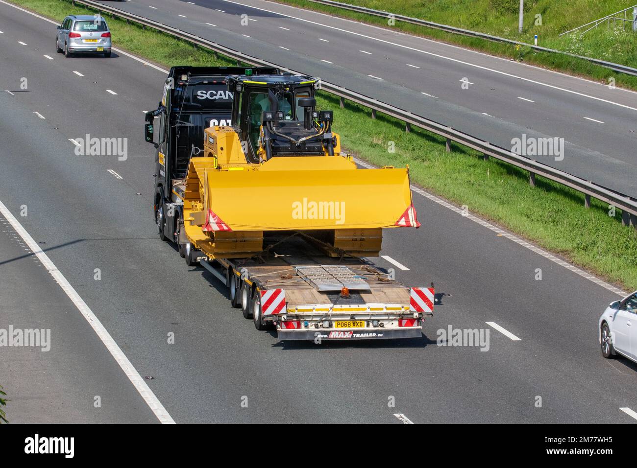 2018 Black SCANIA LORRY S500 A 6X2/2 12742cc Diesel truck carrying new Bulldozer on a low loader MAX trailer; travelling on the M6 motorway, UK Stock Photo