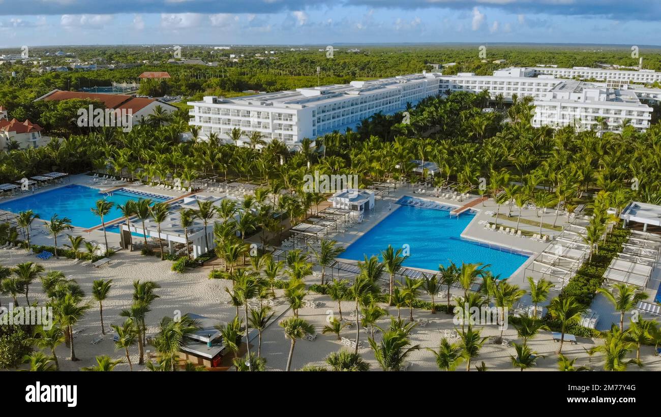 Punta Cana, Dominicana - April 2021: Aerial view of gigantic luxury Riu Republica Hotel Resort in Punta Cana during season. Luxury pools and apartments with Ocean View. Stock Photo