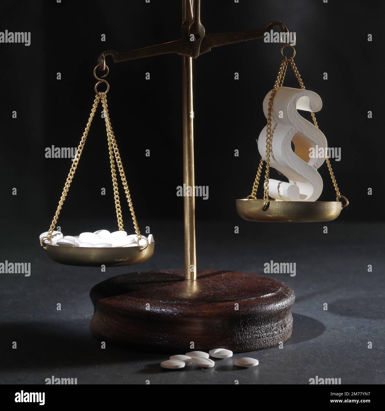 Law in medicine. Scales justice and pills on an abstract background