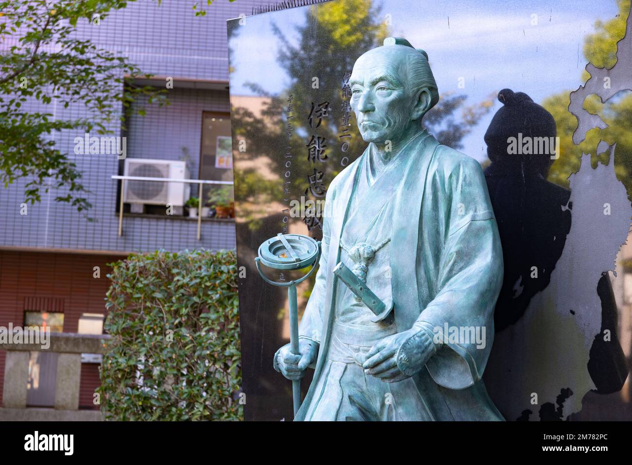 A Japanese stone statue at Tomioka Shrine with copyspace Stock Photo