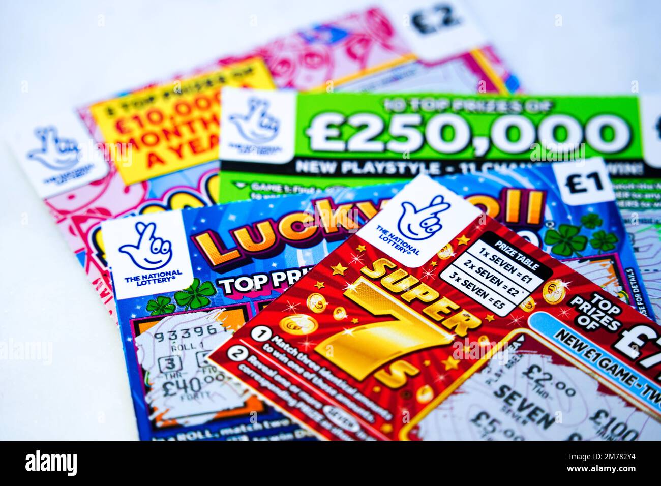 Exeter, UK - January 2023: Selection of UK National Lottery scratchcards, first introduced by Camelot in 1994 Stock Photo