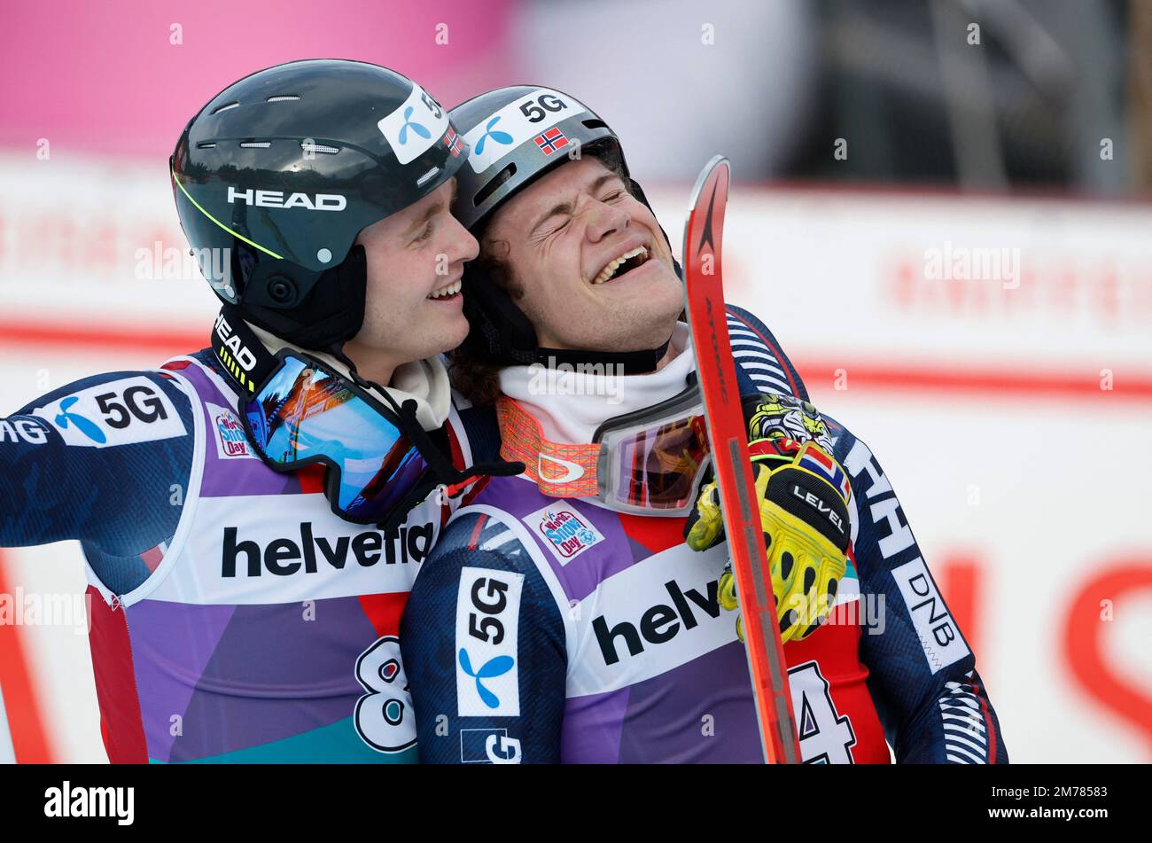 Alpine Skiing - FIS Alpine Ski World Cup - Men's Slalom - Adelboden, Switzerland - January 8, 2023 Norway's Lucas Braathen celebrates after winning alongside Atle Lie McGrath REUTERS/Stefan Wermuth Stock Photo