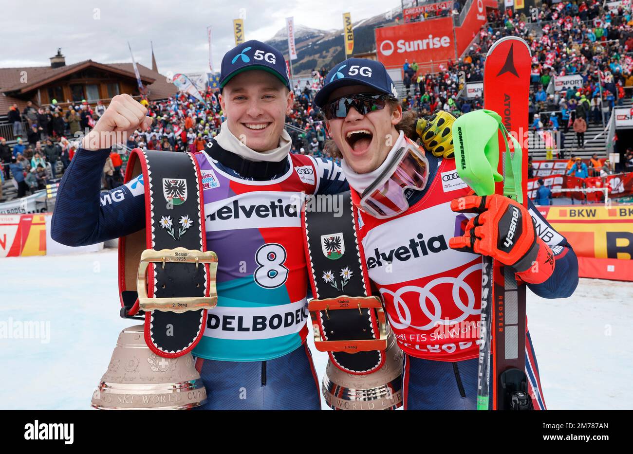 Alpine Skiing - FIS Alpine Ski World Cup - Men's Slalom - Adelboden, Switzerland - January 8, 2023 Norway's Lucas Braathen celebrates with the trophy after winning alongside Norway's Atle Lie McGrath REUTERS/Stefan Wermuth Stock Photo