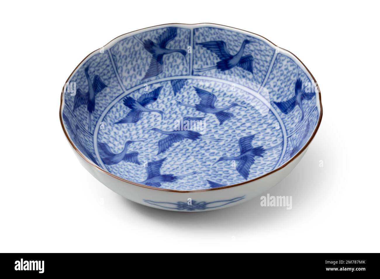 Traditional Japanese blue and white bowl decorated with cranes isolated on white background Stock Photo