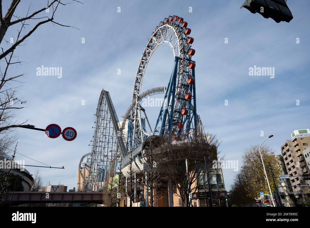 Tokyo, Japan. 6th Jan, 2023. Rollercoasters at the Tokyo Dome City amusement park.The Tokyo Dome is a multi-purpose stadium dome roofed indoor stadium. It was completed in 1988 and has a capacity of 55,000 people. The dome has a retractable roof, making it suitable for hosting both indoor and outdoor events. It is the home of the Yomiuri Giants, a professional baseball team in the Nippon Professional Baseball, and is also used for concerts, exhibitions, and other sporting events. It is a popular tourist attraction and offers a variety of amenities in Tokyo Dome City, including restaurants Stock Photo